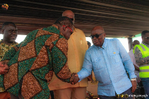 Image of Sam George greeting President Akufo-Addo at the project commissioning venue