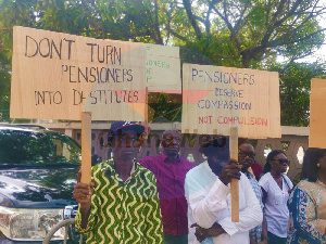 Image of Some pensioners holding placards