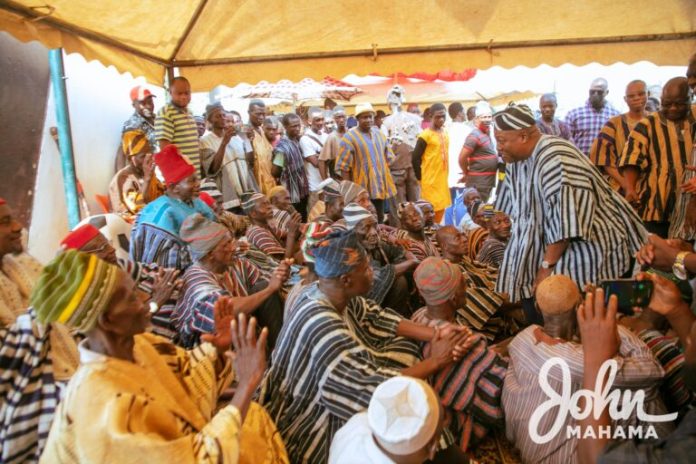 Image of Former President Mahama greets elder of the clan