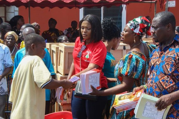 Image of The MP giving out school items to JHS graduates